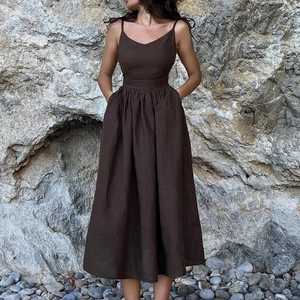 Elegant dark brown high-waisted midi dress with thin straps and practical side pockets