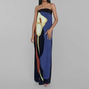 Close-up of the black tube dress featuring a large blue and yellow calla lily floral print