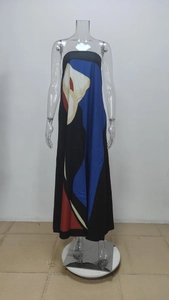 Close-up of abstract geometric floral print on black satin strapless maxi dress