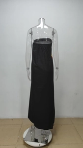 Detail view of the sleek back design on this strapless black long evening dress