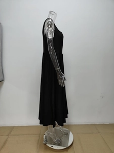 Side view of elegant black off-shoulder maxi dress with high waist and A-line skirt