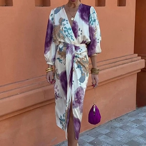 Detail of V-neck abstract print maxi dress with lantern sleeves and waist tie design