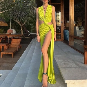 Close-up of waist cutout and twist knot detail on lime green sleeveless dress