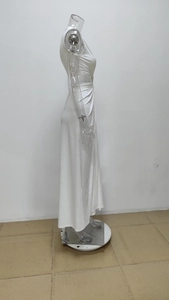 Side view of white maxi dress with cut-out waist and elegant ruched details on high-stretch fabric