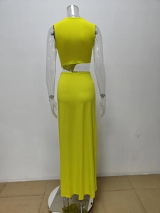 Detail of neon yellow two-piece set with cutout back top and slim maxi skirt