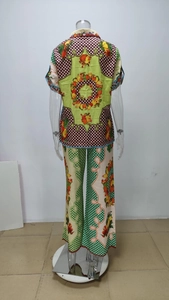 Detail of tropical fruit print and polka dot pattern on silk-like summer lounge set