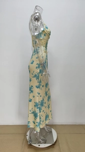 Detailed side view of floral print maxi dress featuring drawstring ruched side seams