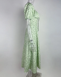 Detail of light green floral midi dress with A-line silhouette and puff sleeve design