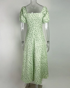 Detail of light green floral dress showing square neckline and hidden back zipper