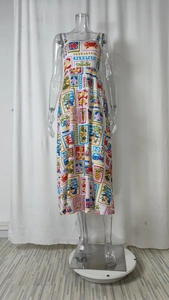 Detail view of summer dress with nautical graffiti prints like anchors and palm trees
