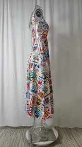 Side view of long tropical dress with colorful stamp prints on transparent mannequin