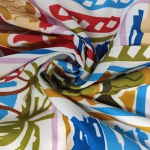 Detail shot of the colorful abstract graffiti print fabric with a soft draped texture