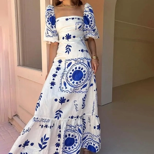 Floral puff sleeve maxi dress with off-shoulder neckline and blue Mediterranean prints