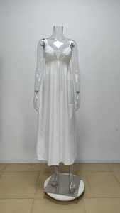 Detailed close-up of white V-neck maxi dress with spaghetti straps and pleated waist