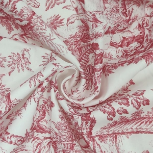 Détail de l'imprimé Toile de Jouy rouge sur tissu blanc avec motifs classiques pour robes