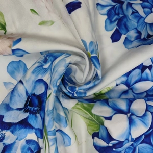 Close-up of elegant blue gradient floral print fabric with high-quality textile texture