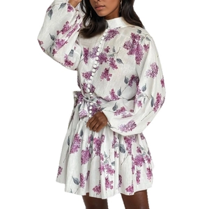Elegant white mini dress with purple floral print, lantern sleeves and waist tie belt