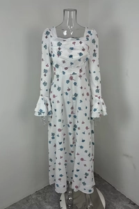 Detail of square neckline with drape and flared ruffle sleeves on floral dress
