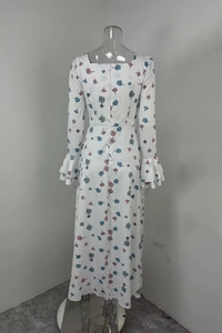 Detail view of floral print maxi dress featuring elegant ruffled cuffs and back zipper