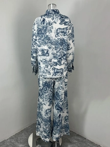 Back view of a long-sleeved shirt and wide-leg trousers set with blue Toile de Jouy prints