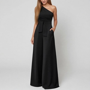 Detail view of black one-shoulder wide-leg jumpsuit featuring a waist bow and side pockets