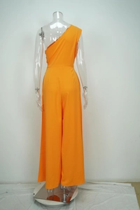 Back view of a vibrant orange one-shoulder wide-leg jumpsuit on a clear mannequin