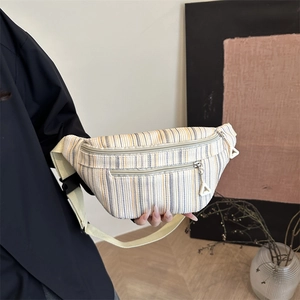 Striped crossbody fanny pack with corduroy texture and adjustable beige strap for women