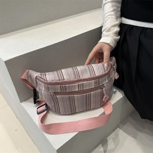 Bohemian striped waist bag in pink and grey with adjustable nylon strap and front zip pocket