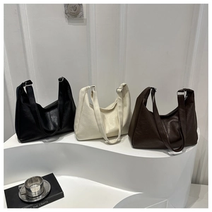 Detailed comparison of large dumpling bags in black, beige, and dark brown faux leather
