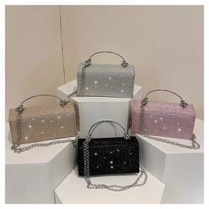 Detail view of sparkling rhinestone evening bags in silver, gold, pink, and black colors