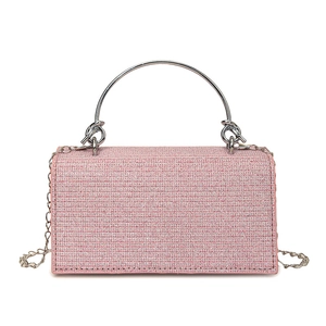 Sparkly pink rhinestone evening bag with silver metal handle and chain strap