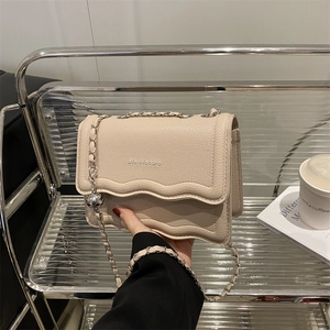 Elegant cream white square flap bag with wavy edge and metal chain strap for women