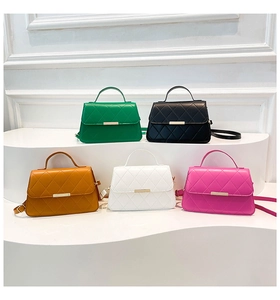 Detailed view of quilted crossbody bags in five colors with golden metal clasps