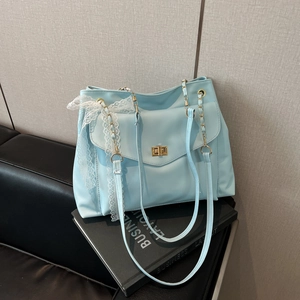 Light blue PU leather tote bag with golden twist lock and white lace bow detail