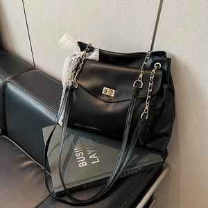 Elegant black PU leather shoulder bag with gold chain strap and lace ribbon detail