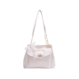 Creamy white leather shoulder bag with a metal lock and lace bow decoration