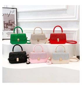 Mini handbag detail showing six candy colors with sequin texture and metallic lock