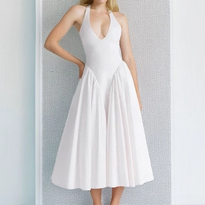 Elegant white halter neck midi dress with a deep V-neckline and pleated maxi skirt detail