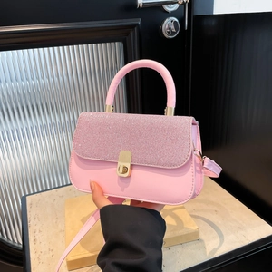 Chic pink glitter crossbody bag with sparkling crystal flap and gold hardware handles