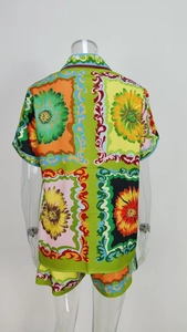 Rear view of vibrant floral print shirt and shorts set with baroque pattern details