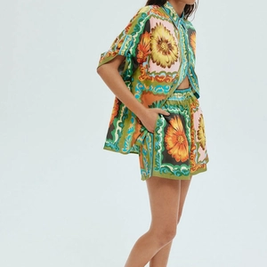 Close-up of women's floral printed set featuring sunflower patterns and drawstring detail