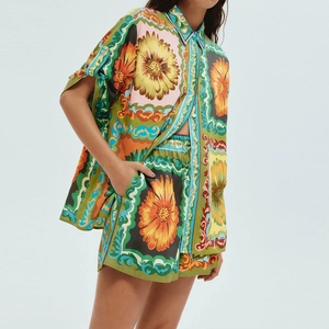 Detail of floral and baroque print on women's short sleeve shirt and shorts set