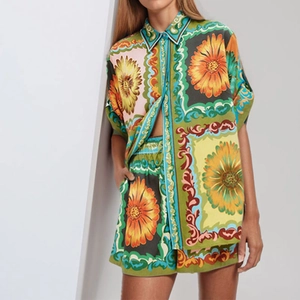 Women's two-piece set featuring a floral lapel shirt and drawstring shorts in green print