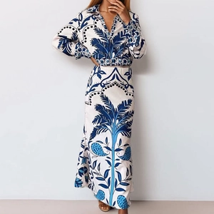 Women boho two-piece set featuring blue and white tropical print maxi skirt and crop top