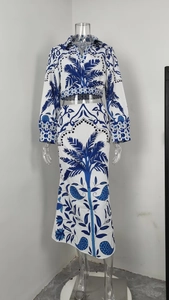 Detail view of two-piece set featuring tropical palm leaf print top and maxi skirt