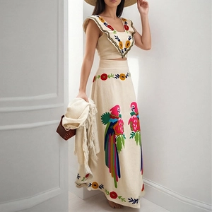 Bohemian two-piece set with vibrant parrot embroidery and ruffled V-neck crop top