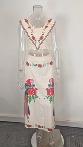 Detailed view of bohemian floral print two-piece set with parrot pattern and ruffle design