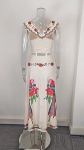 Detail view of tropical floral print ruffled crop top with a back zipper closure