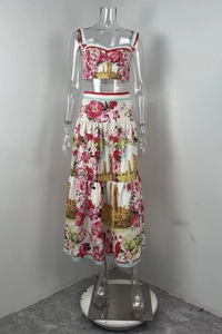 Detail view of floral and temple print women's two-piece crop top and tiered skirt set
