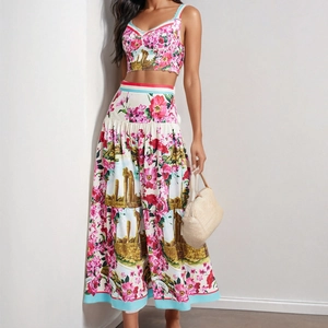 Detail of floral and architectural print on a two-piece crop top and high-waisted skirt set
